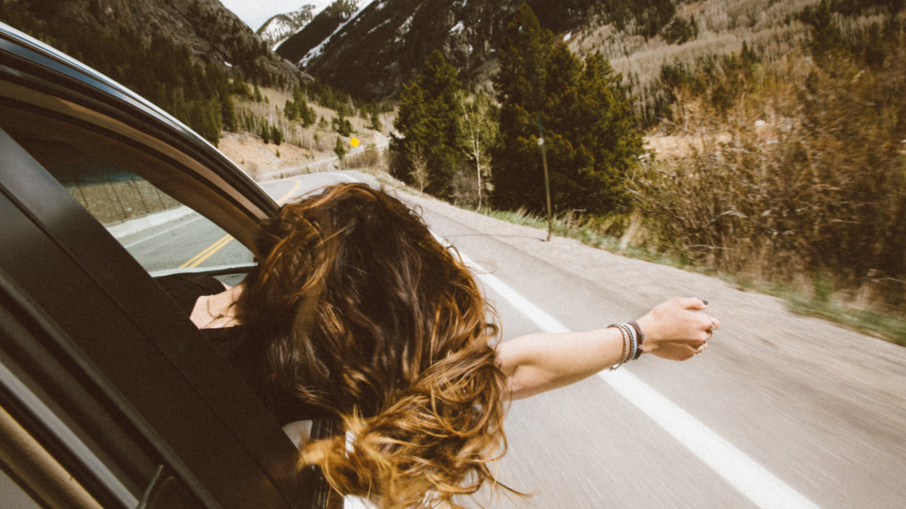 photo of woman in a car